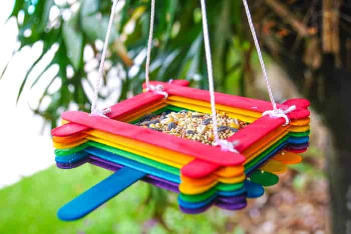 How do you make a popsicle stick bird feeder?