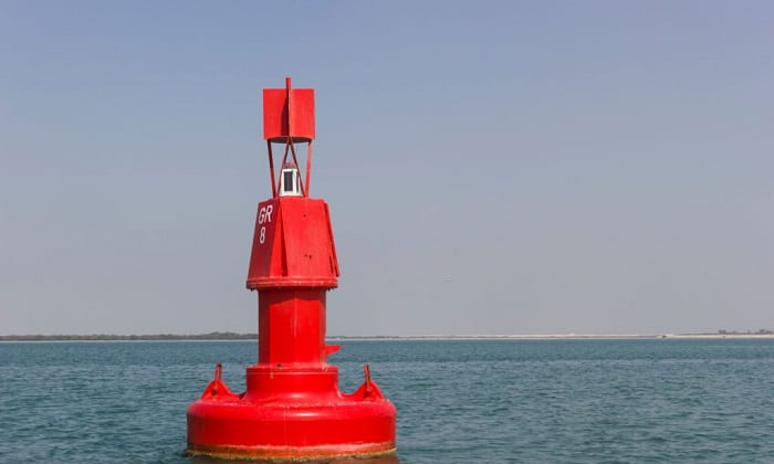 How do you respond to a red buoy?