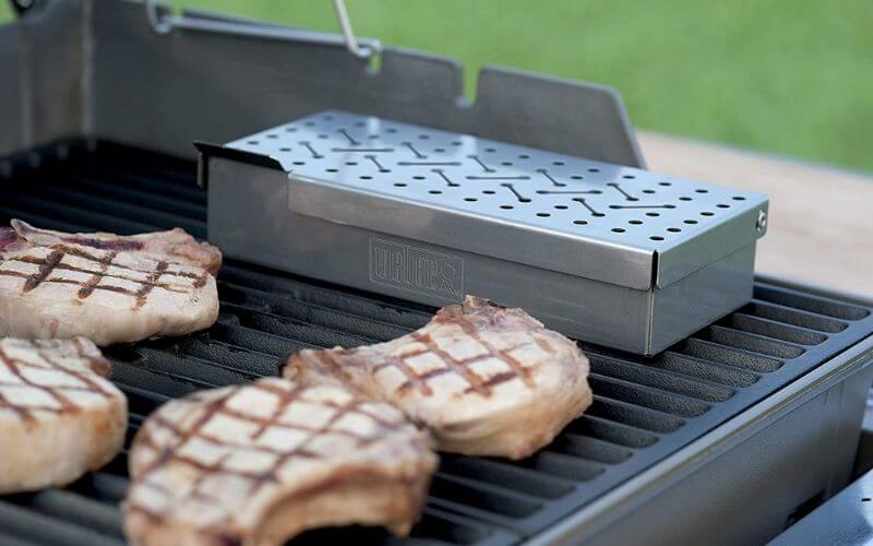 How do you use a cast iron smoker box for gas grill?