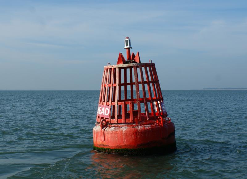 What does a red and black buoy mean?