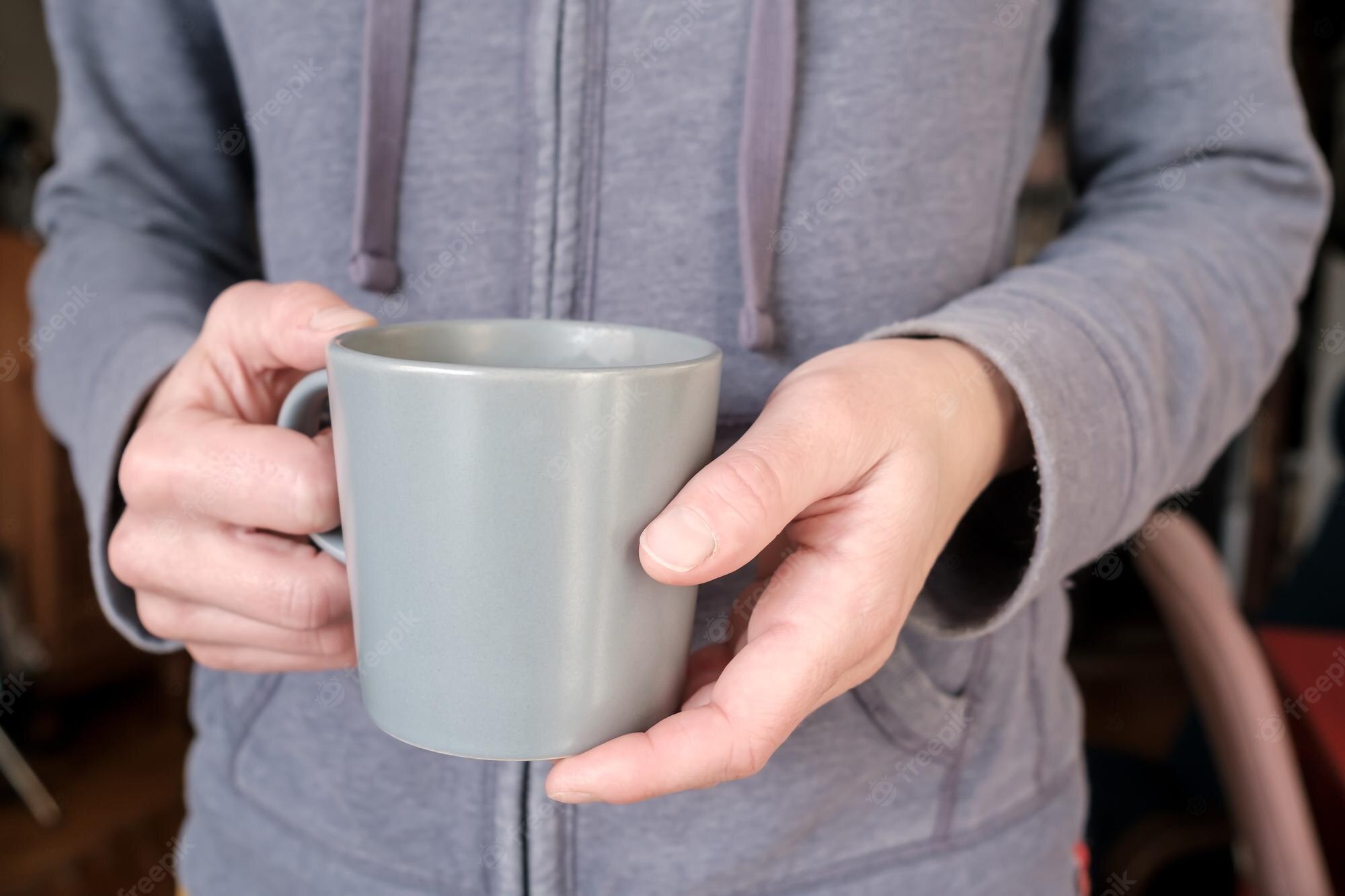 What hand do you hold a mug?