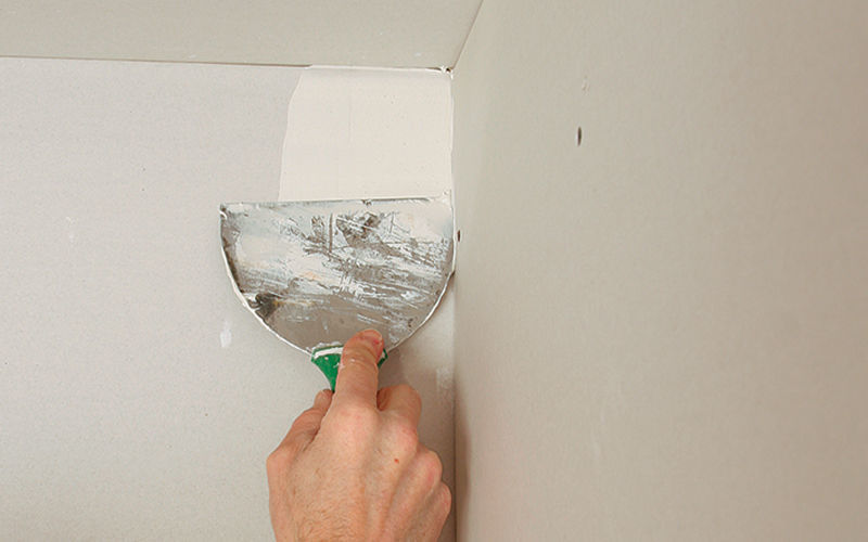 Do you overlap drywall tape in corners?