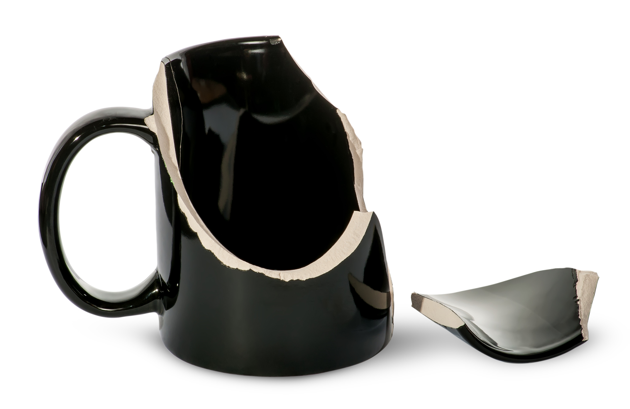 Broken black porcelain cup with one fragment